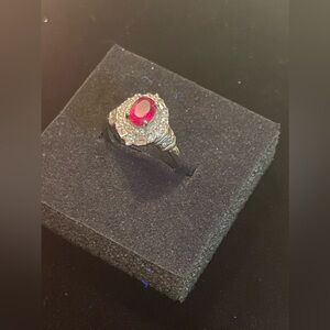 Ruby Ring: Adjustable With 925 Silver & Cubic Zirconia. Have Matching earrings.